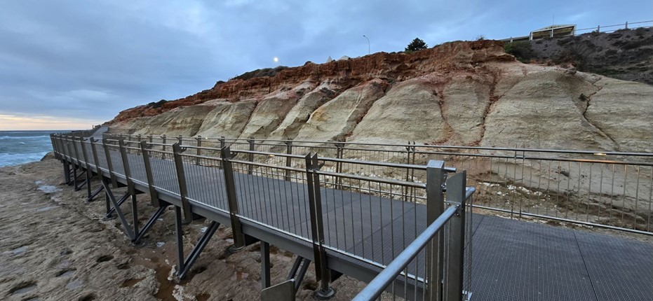 Image of cliff and rail