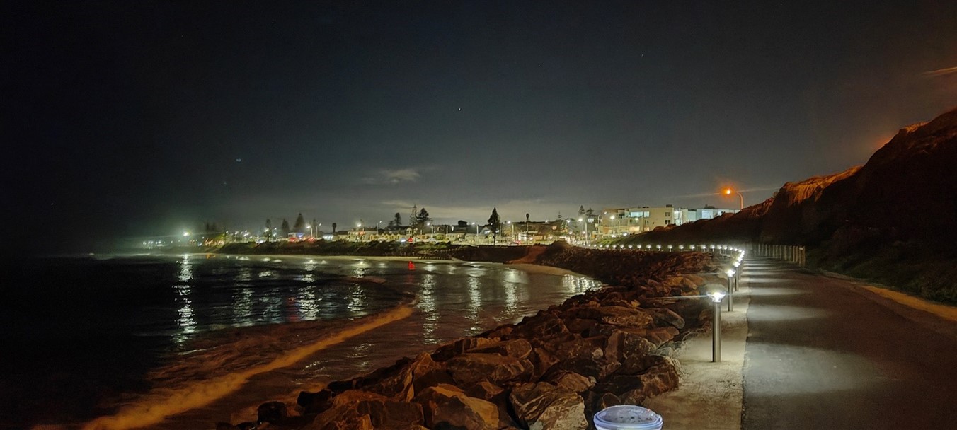 Image of trail at night winding around the cliff